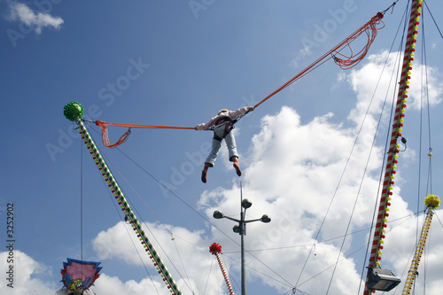 Photo: girl hangin in bungee ropes girl hangin in bungee ropes