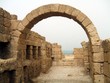 arch over a path/entrance to the beach. ruins