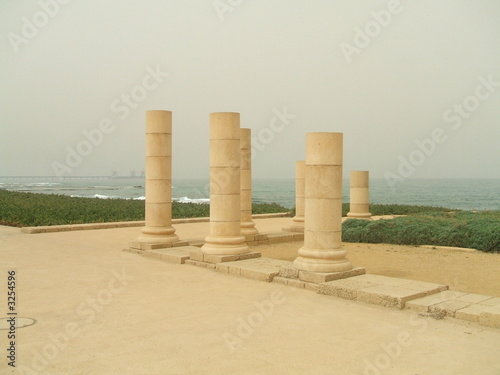 columns of roman capital city/caesarea on beach
