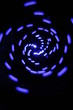 blue spiral abstract against black background. blue spiral abstract against black background.