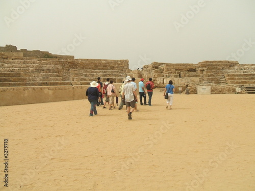 tourists in the ancient roman theater in caesarea