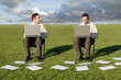 two businessmen on laptops