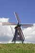 dutch windmill against a blue sky