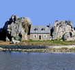 house on island between rocks