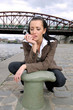 thoughtful girl with mobile phone