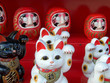 lucky cats and daruma dolls