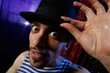 dramatic portrait of a young man in cylinder hat