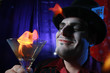 magician with flaming martini glass