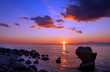 sunset over rocky beach