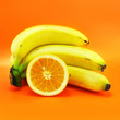bananas and orange (isolated on orange) bananas and orange (isolated on orange)