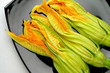 zucchini flowers on black plate zucchini flowers on black plate
