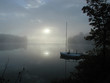 sunrise over misty lake