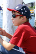 child sitting on jetty wharf