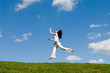jumping girl in meadow