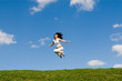 jumping girl in meadow