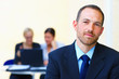 Natural looking business leader in an office environment Natural looking business leader in an office environment