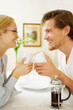 Successful loving couple in their kitchen drinking coffee