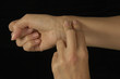 female shown taking her own pulse female shown taking her own pulse