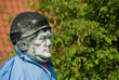 old ancient stone statue used as a scarecrow 04 old ancient stone statue used as a scarecrow 04
