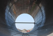 Construction Pipe with backend loader in distance