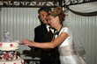 Bridal Couple Cutting Cake