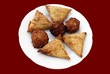 Vegetable samosas, onion bhajis, & vegetable pakoras