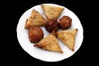 Vegetable samosas, onion bhajis, & vegetable pakoras