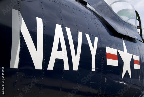 Photo: US Navy markings on the side of a restored vintage aircraft. US Navy markings on the side of a restored vintage aircraft.