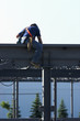 Construction worker welding on an I-beam 