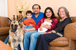 An East-Indian family sits in their living room