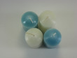 assortment of wax candles against a white background assortment of wax candles against a white background