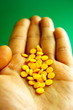 Palmful of yellow pills Palmful of yellow pills