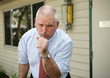 A businessman coughing with a severe chest cold. A businessman coughing with a severe chest cold.