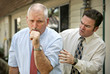 A mature businessman with a severe cough. A mature businessman with a severe cough.