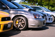 A bunch of Subaru Imprezas parked side by side