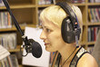 Young girl as announcer and dj at small broadcasting station