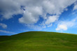 Green hill dramatic sky