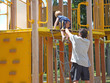 Father and son a leg up at the playground