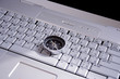 magnetic compass on a laptop, business travel concept