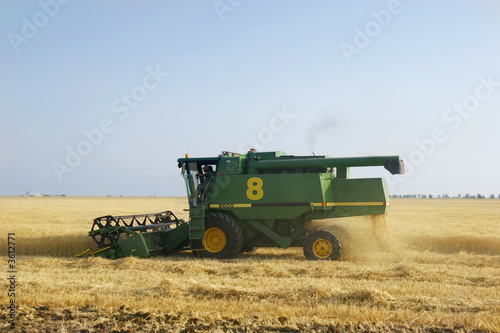 combine on wheat field combine on wheat field