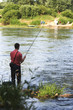 Man fly fishing in creek