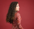 Young woman portrait isolated on red