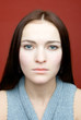 Young woman portrait isolated on red background