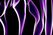 purple silky smoke waves over black background