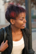 African American businesswoman portrait at bus stop