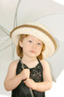 Small pretty girl with umbrella and hat Small pretty girl with umbrella and hat