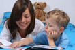 mother and three years old boy reading book - good night mother and three years old boy reading book - good night