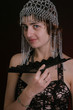 pretty young lady in old time ball dress with black fan. pretty young lady in old time ball dress with black fan.