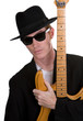 A Guitar Player Dressed In Black Posing A Guitar Player Dressed In Black Posing