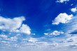 The blue sky and beautiful white clouds.
